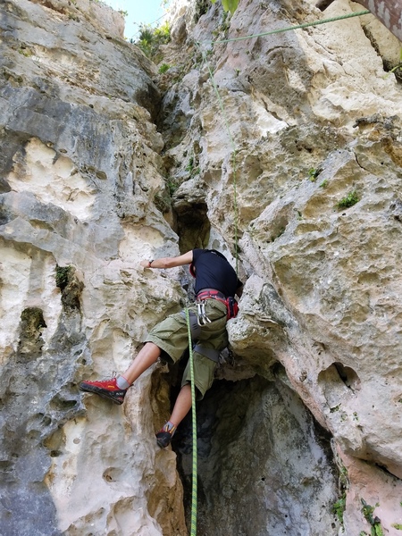 Audi at the start of "La Otra Esquina", listed in the guidebook at 5.9, this is a fun 5.7 that is very vegetatef but worth doing and easiest route on cliff.