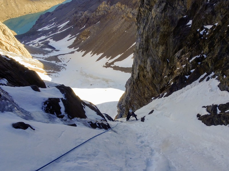 Natalie over the ice and into the couloir proper on our 80m entry pitch (we simuled a fair bit with a 60m rope). Convict Lake top left