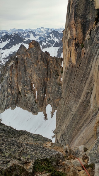 Looking right, out at the blank sections of the south face from the pitch 5 belay.