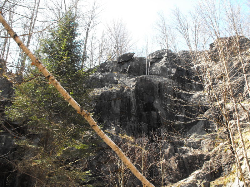 Capstone is on the far left, you can see the 2 obvious small overhanging sections to climb, you can see the top anchors at the top left.
