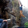 Sticking the huge left hand throw on problem 13. Despite the little lump of rock underneath, the fall is super comfy.