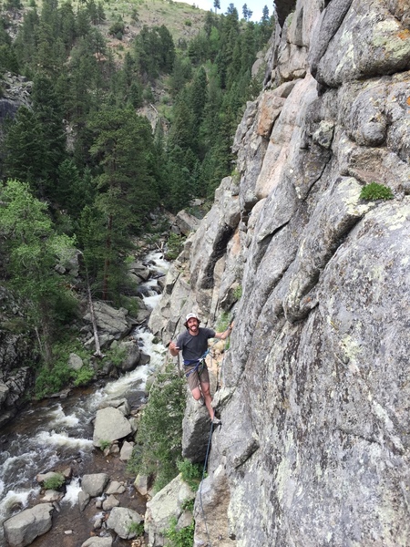 Tom at the top of P1 taken from Divination P1 belay.