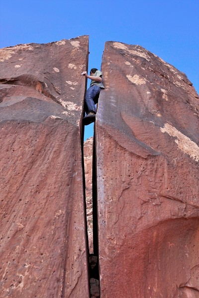 Getting into the offwidth section after laybacking the lower half.