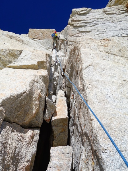 Pulling the 10b crux on Pitch 3.