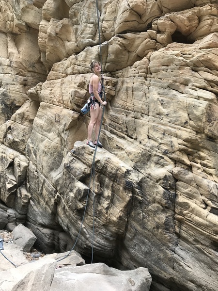 Ash smiling after a couple of burns and cleaning the unnamed 5.10c! Starts on the mantle and goes straight up!