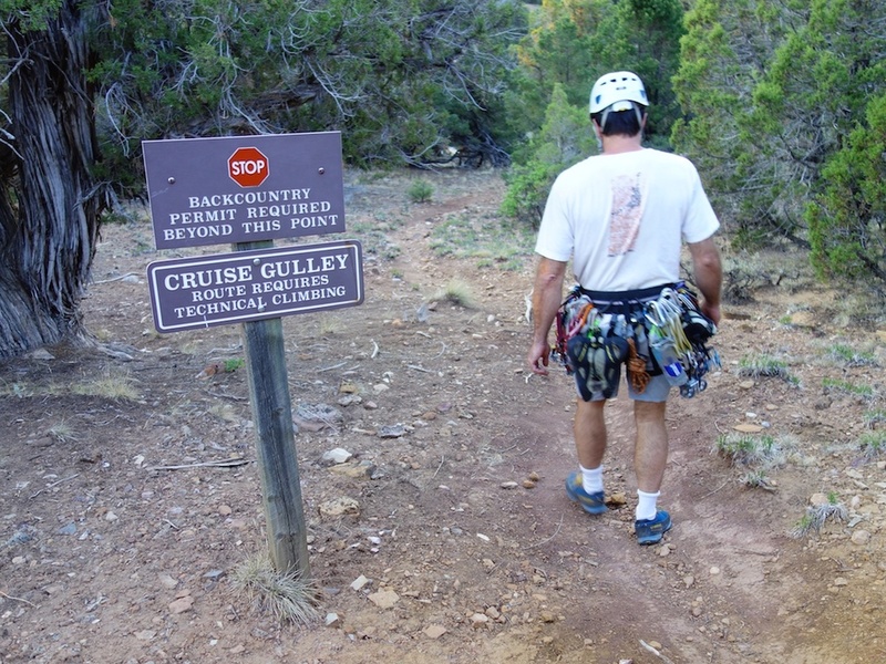 Entrance to Cruise Gully is signed and just off the road to the right as you walk from the campground towards the Ranger Station. The sign isn't visible from road, but it is on an obvious trail just a bit further down the road than the SOB Gully entrance.