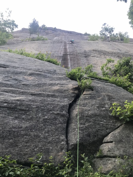 Vic de Quehen on Ebb and Flow, Canada Day 2018 - the water-carved waves make this a distinctive route on Potter's sunny south face.