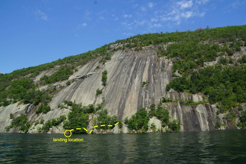There is a cluster of trees at onlookers slight left of center. There is a nice spot that gets shallow to pull a canoe or boat in. We struggled finding a good description of where to land the canoe, figured I would upload a picture describing the location