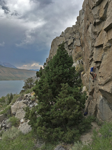 andy s. on the technical crux of the route. note that he placed a small cam under the little lip between the 1st and 2nd bolt.