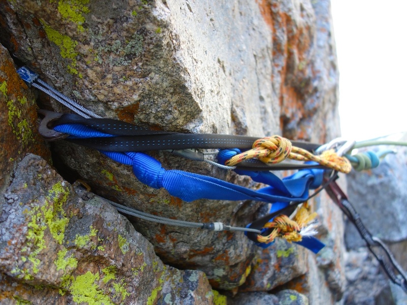Rap 5: 180' to the top of the approach gully. (Important: there is a nicer looking rap anchor on a boulder on the ledge, but the rope pull from this would be difficult if not impossible, so it is best to rap from the edge of the ledge.)
