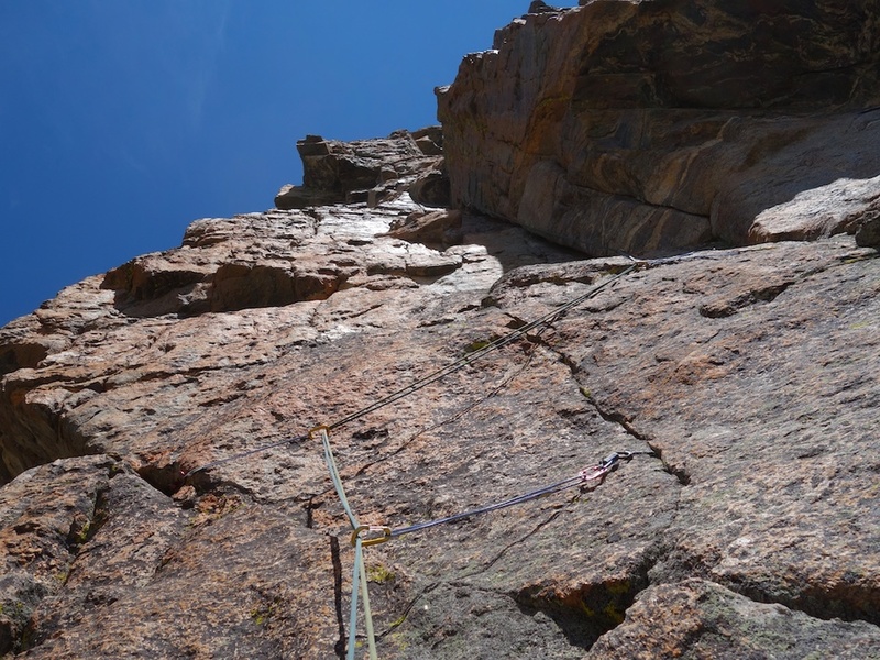 Pitch 3. Go left from belay, then ascend up face with thin cracks, and climb the left-facing corner above.