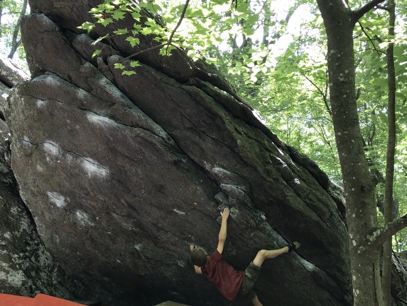 Keegan several moves in, preparing for the crux sequence.