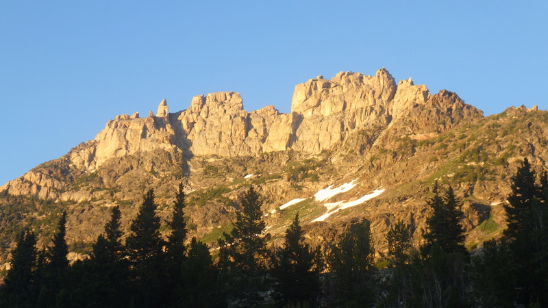 North West chimney route is the obvious shadowed chimney left of the north (left) summit block. Jipe Point is the spire rising up from the chimney