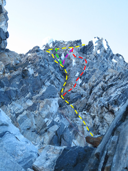 View of the SE Chimneys during evening rappel. Yellow = normal route (exit left after second chockstone, cross back right above). Red = Right hand variation (exit right below first chockstone; best option when dry). Green = direct exit (5.8 or A0). Purple