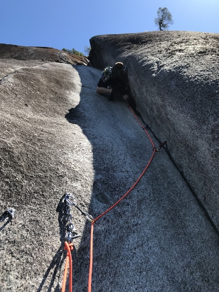 Me questing up the 5.8 crack pitch, after climbing a number of corner cracks in my time it feels comparable to like 5.10b.