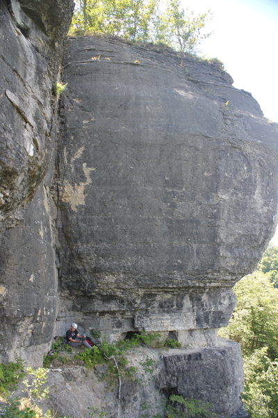Just before the first ascent Ben Watrous preps gear during the development phase (2015-2017) prior to public opening, the greenery on the ledge has been cleaned up since then.
