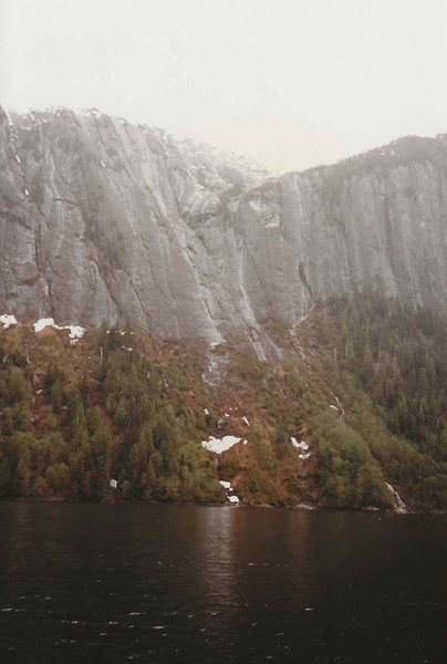 This is what the approach looks like in early springtime. The route has a lot of avalanches which cleans the wall and the approach. It grows back fast in the summer.
