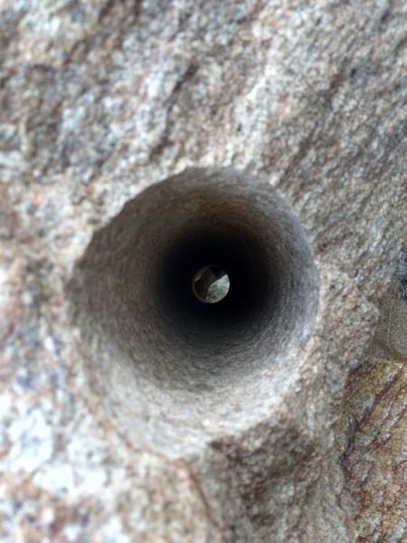 Drill hole in boulder from Hwy. 38 construction, 8000 Foot Crag