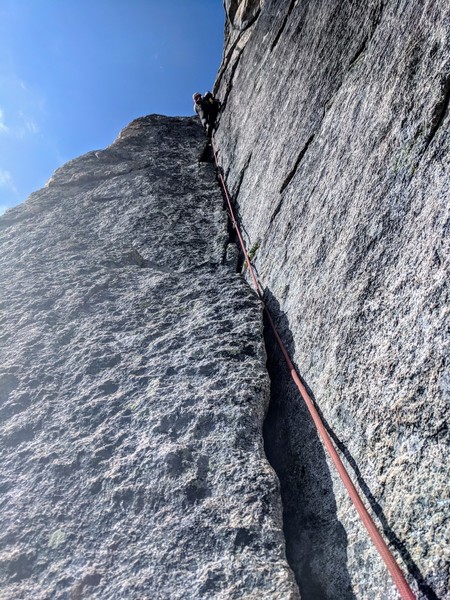 Pitch 2. Alex owning the super fun 5.10 corner heading up towards the roof.