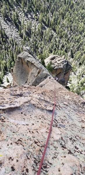 The optional but highly recommended fourth pitch from the top of BMPM to the summit of the Questa Flatiron climbs the wildly exposed ridge/arete to great chickenheads. August 2018.