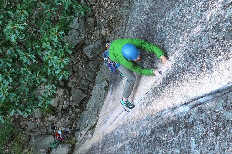 Benson sinking the jams at the crux