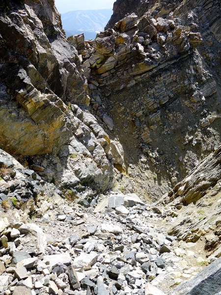 Descent gully. Descend straight west, then cut left to notch and go down that gully alongside south face.