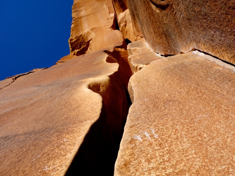 Climb the wide crack on the left or the fingercrack on the right, or a mix of both.