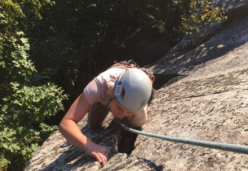Josie pulling out of the offwidth and into the last couple moves of the climb