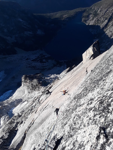 Climbing up through the dihedral in the center of the fin, right of the backbone route, possibly the 'underclung' description ... to a loose rock belay station. Fantastic climbing with a commiting hand jam to a delicate belay ledge.