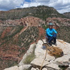 Em on the summit, with the approach gully obvious behind and immediately left of her. Also visible is the spring in the Coconino layer, which was flowing in May when we were there and was very welcome on the hot hike out!