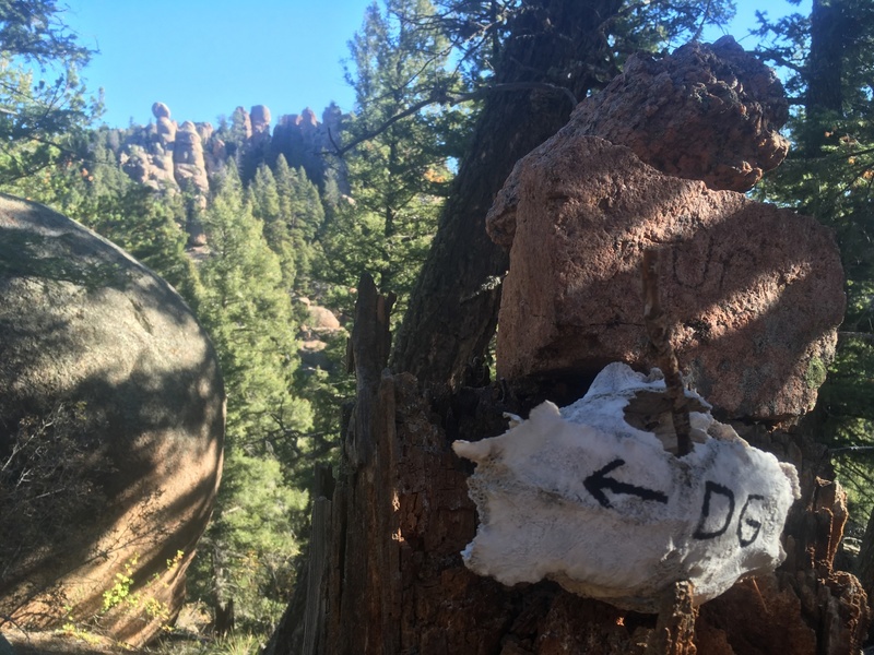 A sign from the Devil at the fork in the approach.