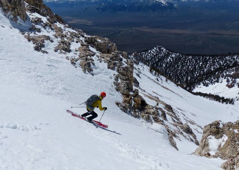 Dean Lords lining up the final chute on the (possible? unknown) first ski descent of West Face.