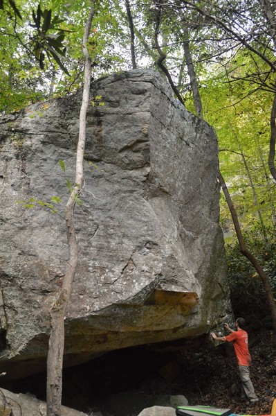Marshall at the bottom lip of the boulder. Casablanca (v9) starts way under the roof, turns the lip and rides the high, right arete corner.