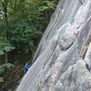 View of the traversing P1 from the belay ledge anchor.