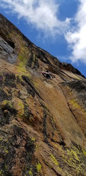 Climber at the end of the ramp and heading up on Twisted Sister