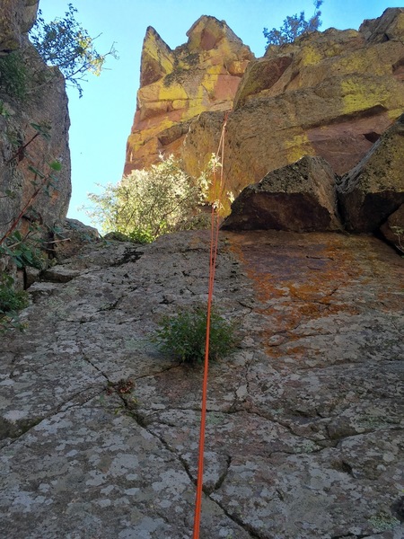 Looking up the north face of the Cake from solid ground just below the notch between the Cake & the Candle