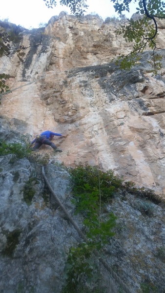 Starting up Foucault's Pendulum (6a+). Note the fixed rope used to access the base of the route.