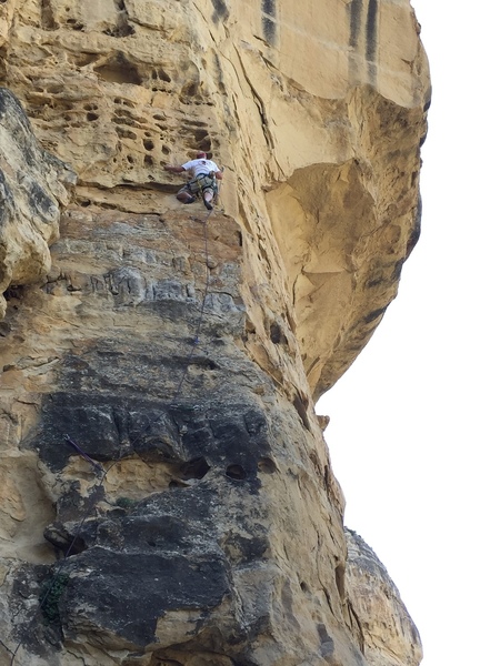View from the ground of an early ascent, starting the crux