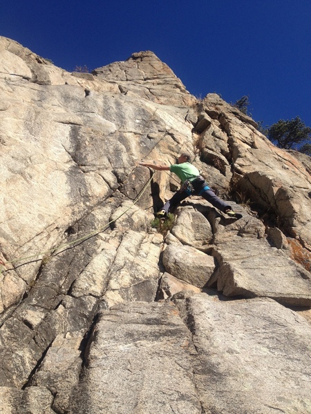 Near the bottom at the second bolt.