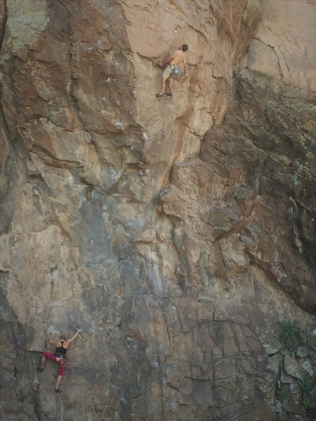 Aaron on FA of Tempest in upper right corner of photo with Gabriella climbing Renaissance in pink pants below.