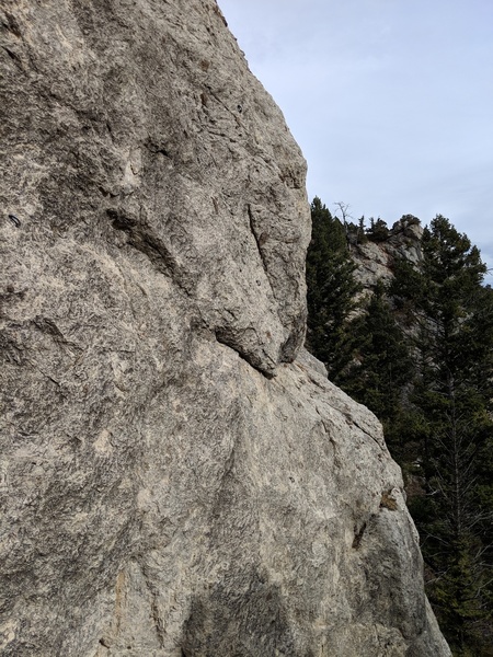 Climbs right most line on the wall, starts down the hill a bit.