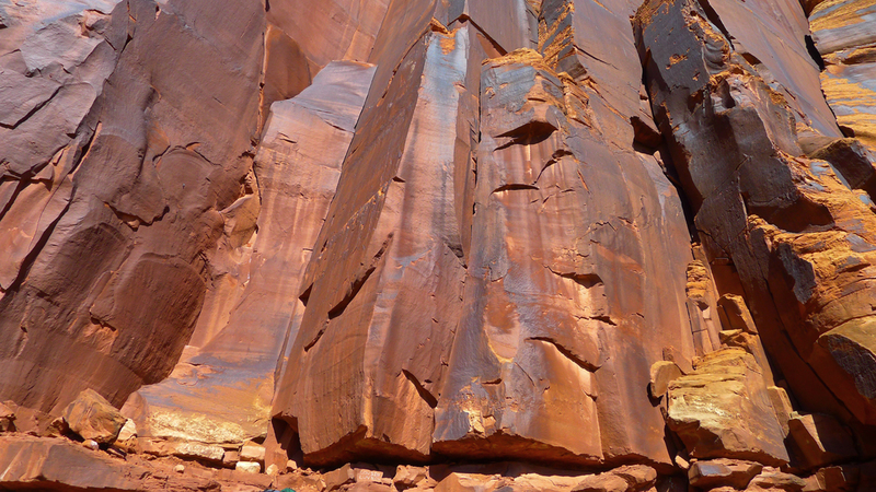 Cousin Luv'n climbs an offwidth in a shallow dihedral (center of photo).