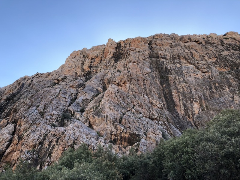 Pink Lady from the base - access ramps visible at center, black streak and rib seen near the top of the wall in this photo.