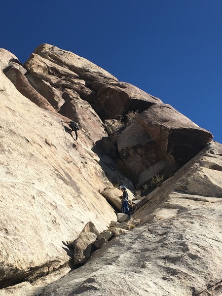 Alex belaying Cameron at base of climb