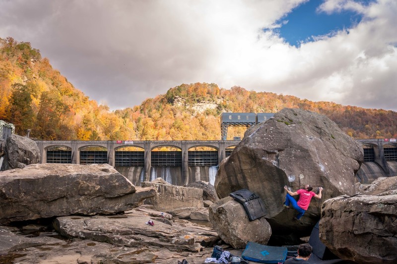 Luke working the difficult first move on a beautiful fall day.
<br>
<br>
Note the large boulder on the left, which fairly recently showed up under the landing for White Eyebrow. Most likely moved after a major flood sometime before winter 2017.
