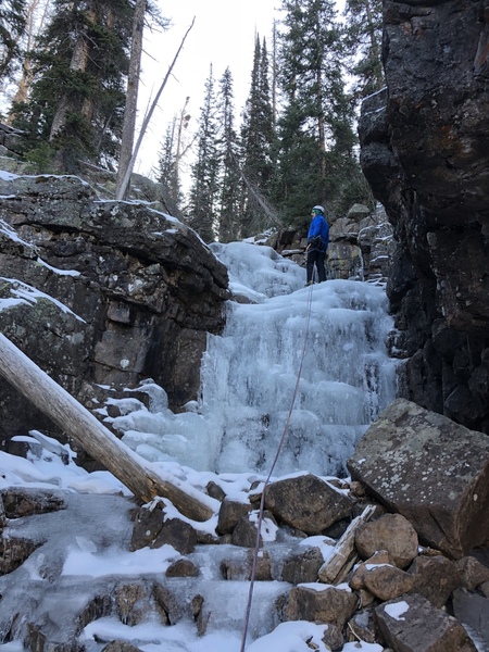 Jason checking out the little bit more ice past the top of the route.