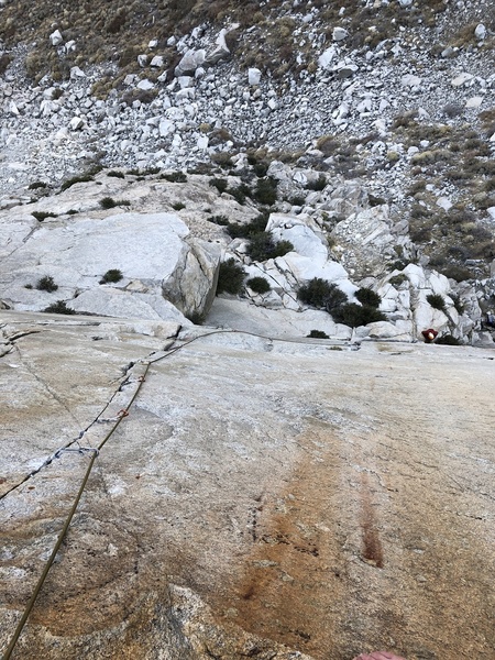 P2: Bottom half is a broken crack followed by a fun traversing roof (5.8). This puts you at the base of the final splitter section (11a).