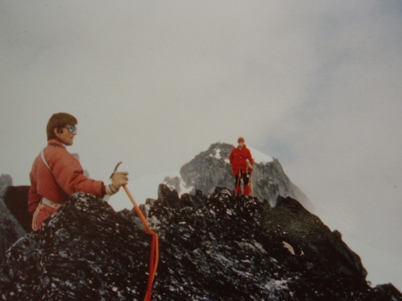Roy Preshaw on the summit of Turret; Mt Adamant behind Mary-Jane Cross on the Adamant-Turret-Austerity Traverse ACC "Senior Camp" 1977