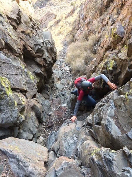 Teresa, making her way through the lower gully section. Helmets are a very good idea... lots of loose rock.