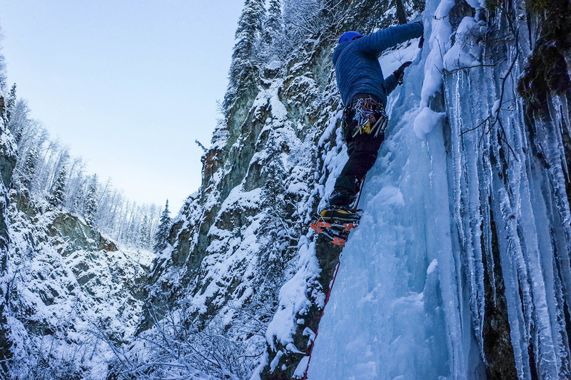 Bryan Hesse placing an ice screw on the first pitch of Ripple